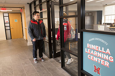 Student standing outside Rinella Learning Center