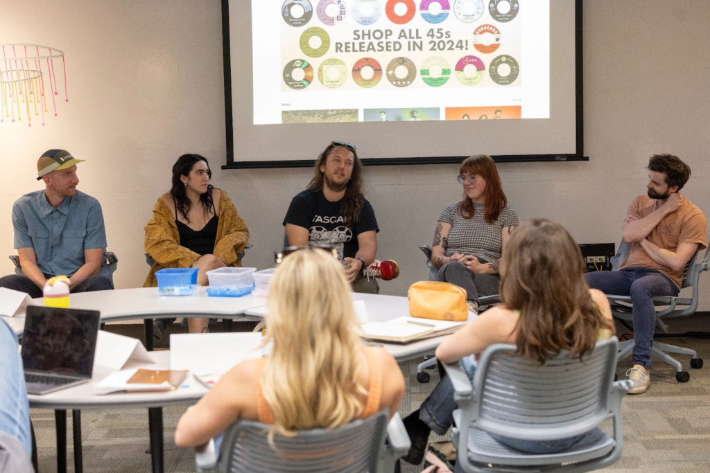 A group of students talking in a circle. 