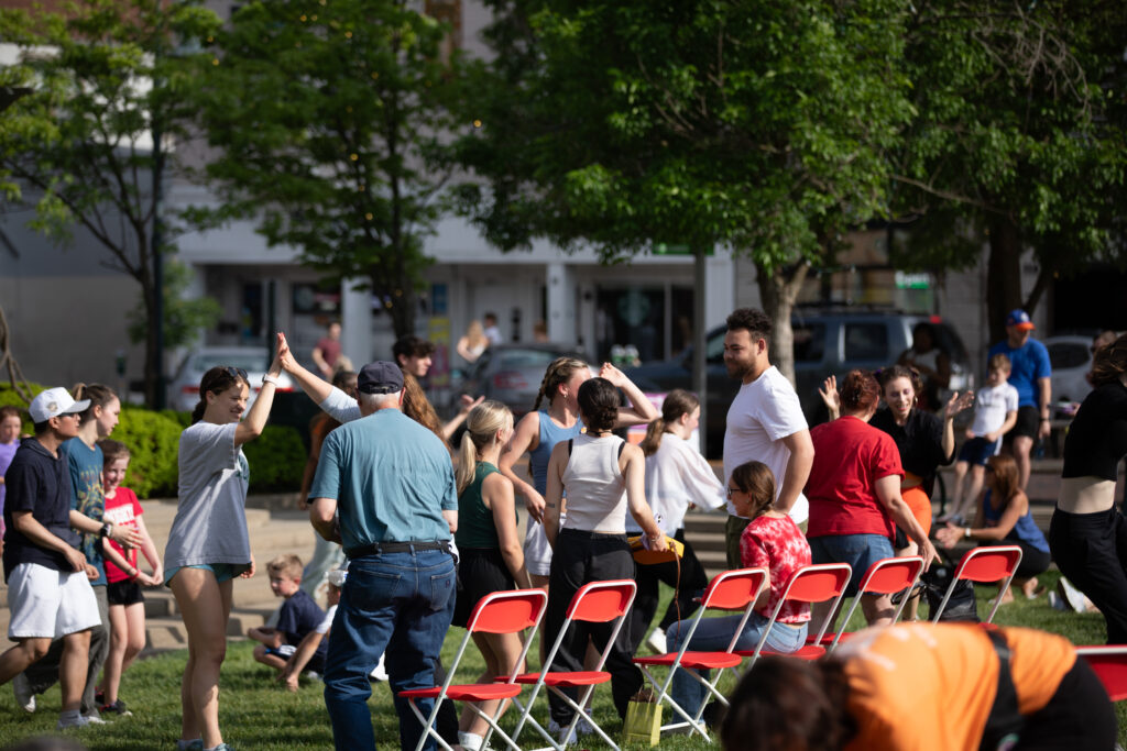 People gathering and dancing at Uptown Park