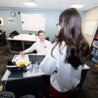 A student checking in at the Rinella Learning Center