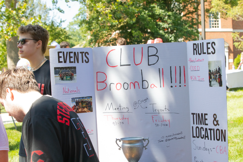 A poster board for the broomball club.