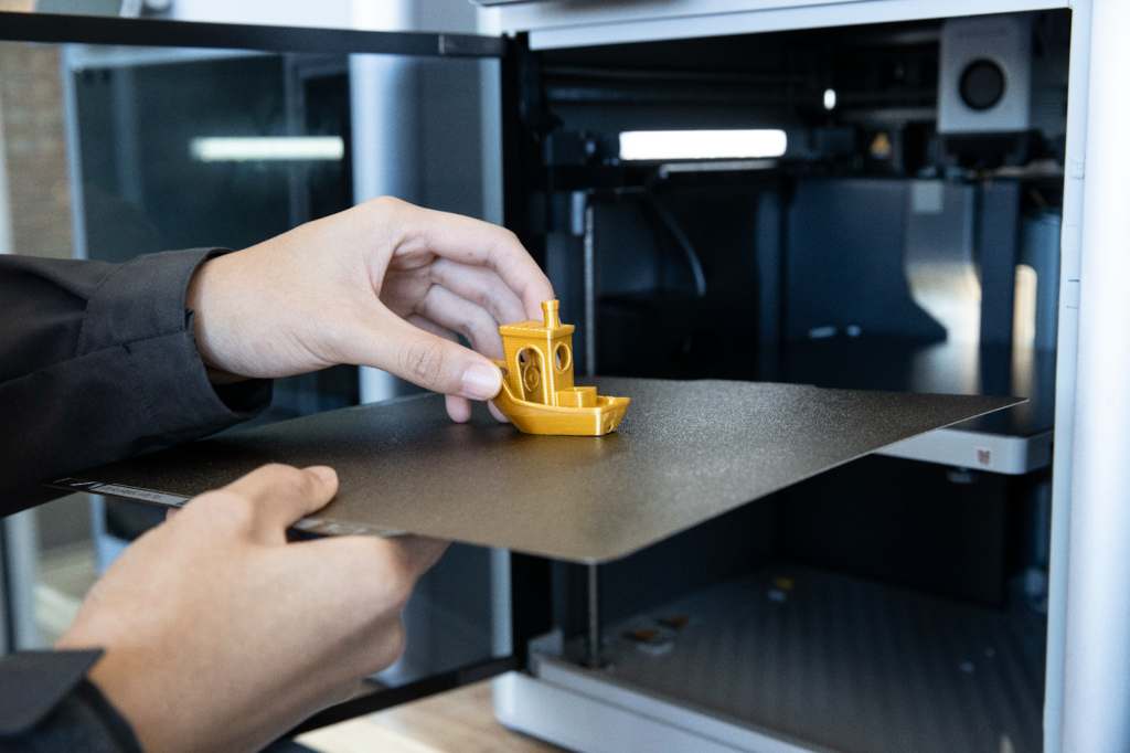 A 3D printer that made a mini boat.