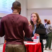Student talking to a recruiter