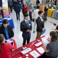 Students talking to recruiters at a career fair